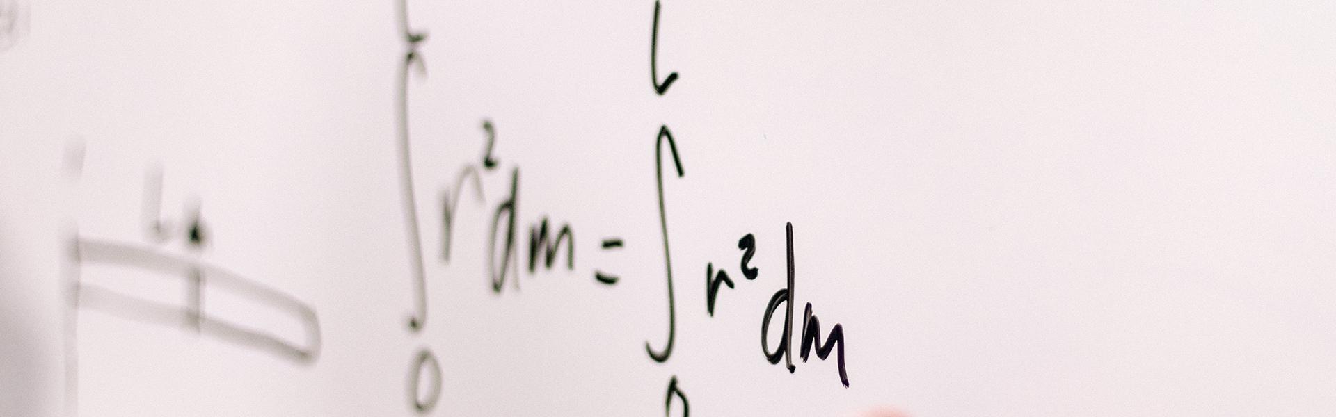 Math on a whiteboard.