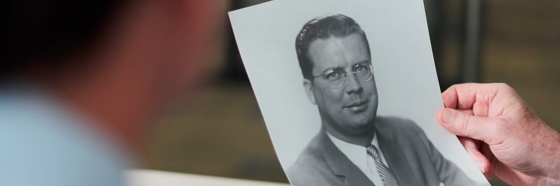 photo of a hand holding a photo of gordon s. lang