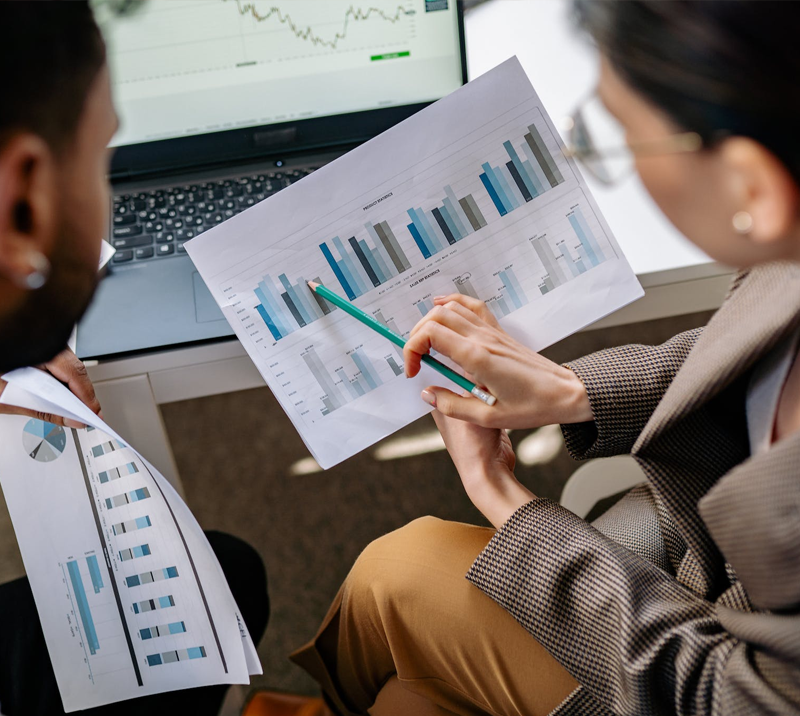 researchers looking at a chart