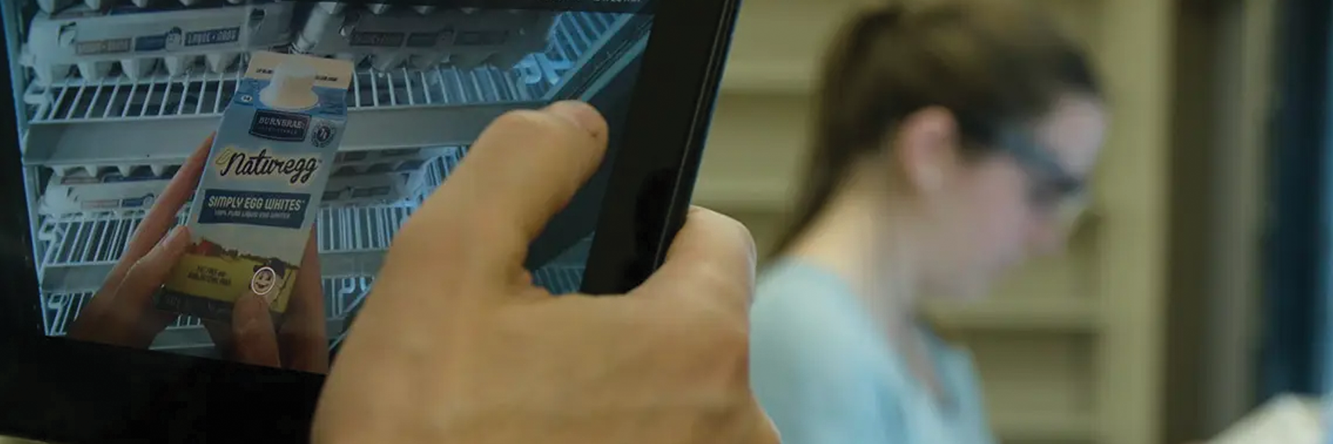 photo of a tablet watching someone pick out a grocery item in the longo's food lab