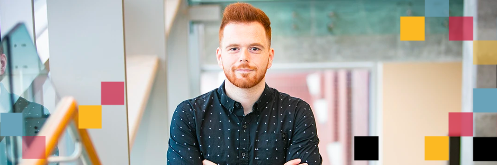 Person standing with their arms crossed.