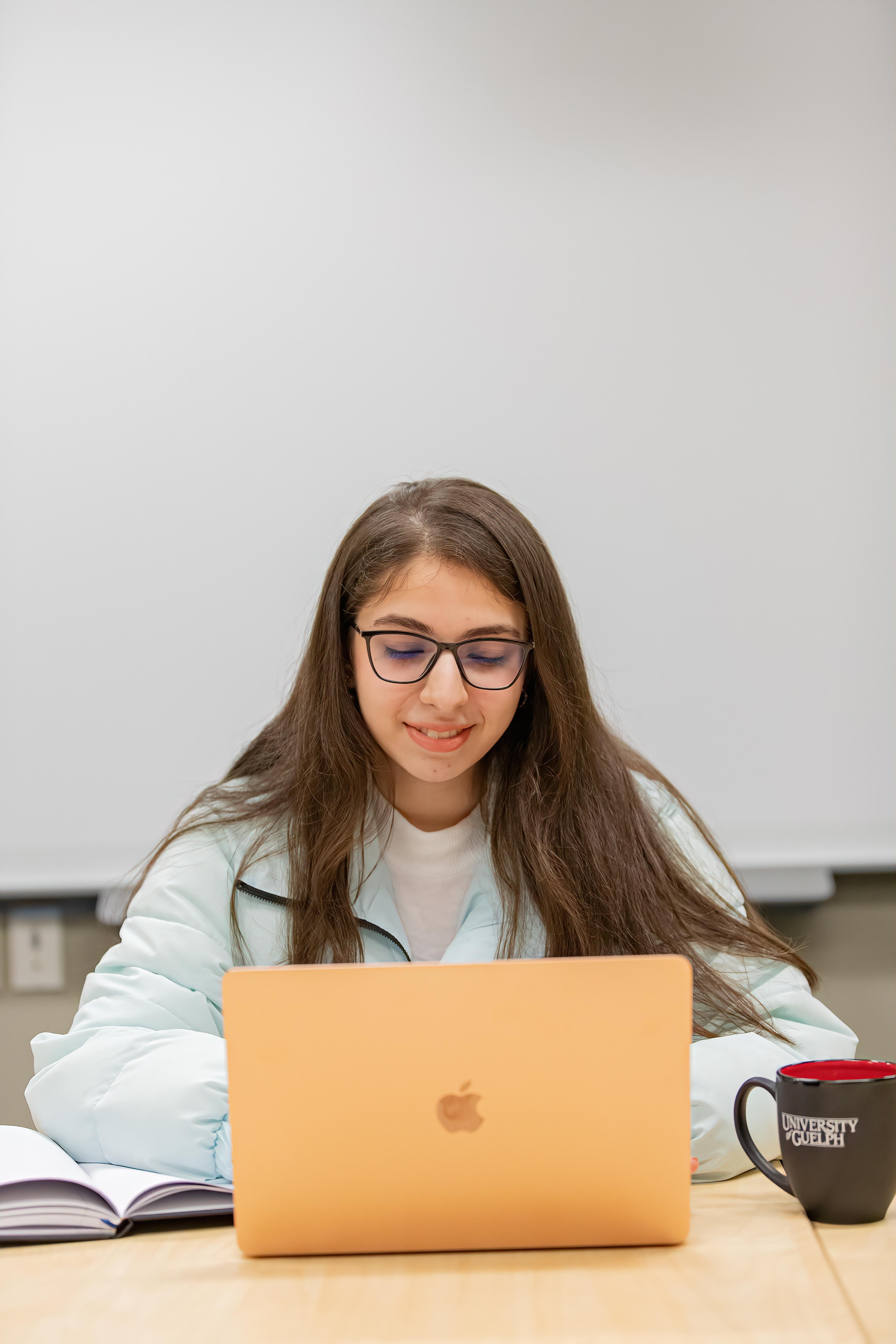 person works on a laptop computer