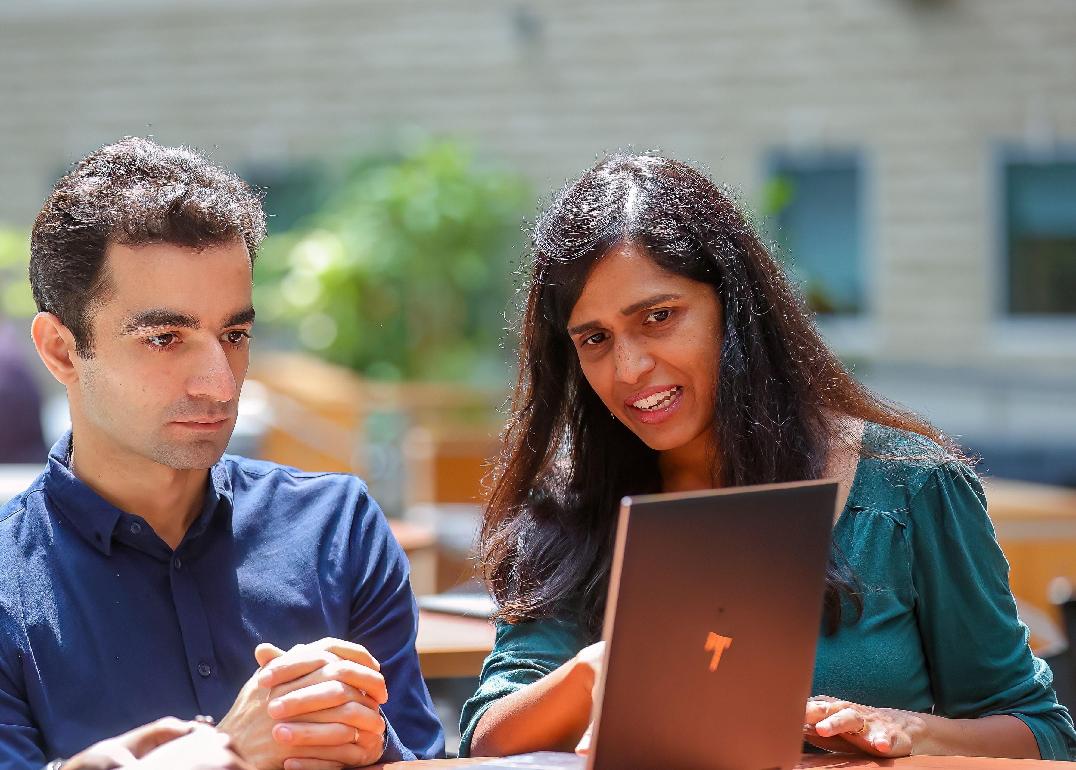 Student and professor with lap top