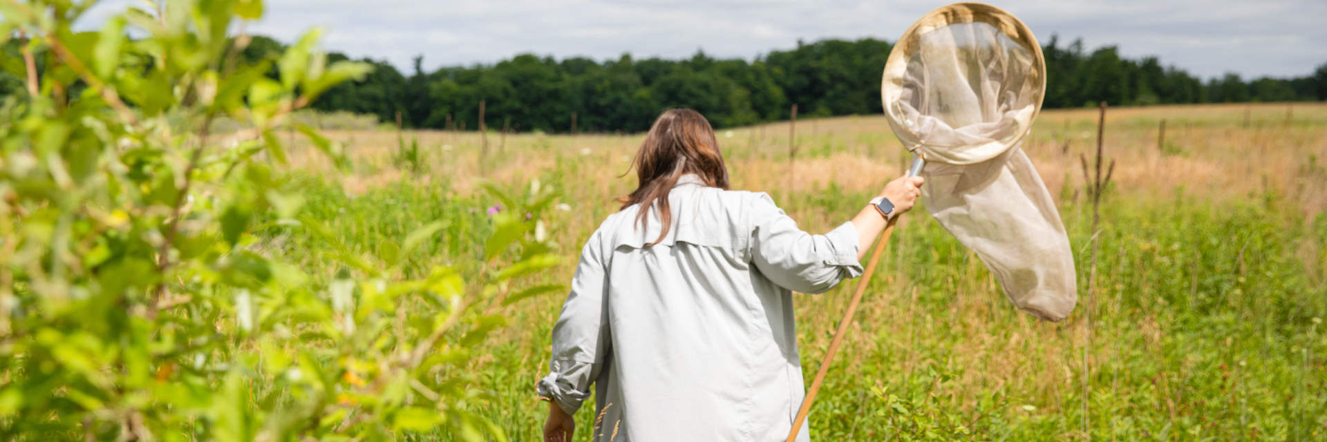 Student with bug net