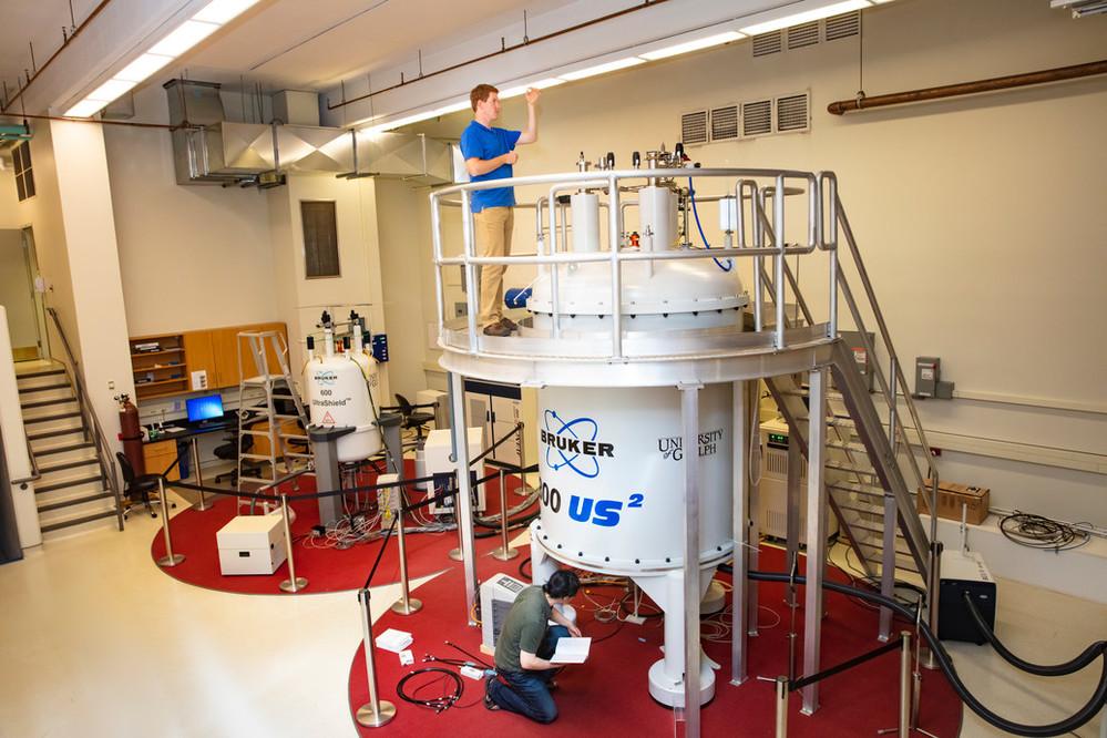 Two graduate students working in the University's NMR Centre/Advanced Analysis Centre
