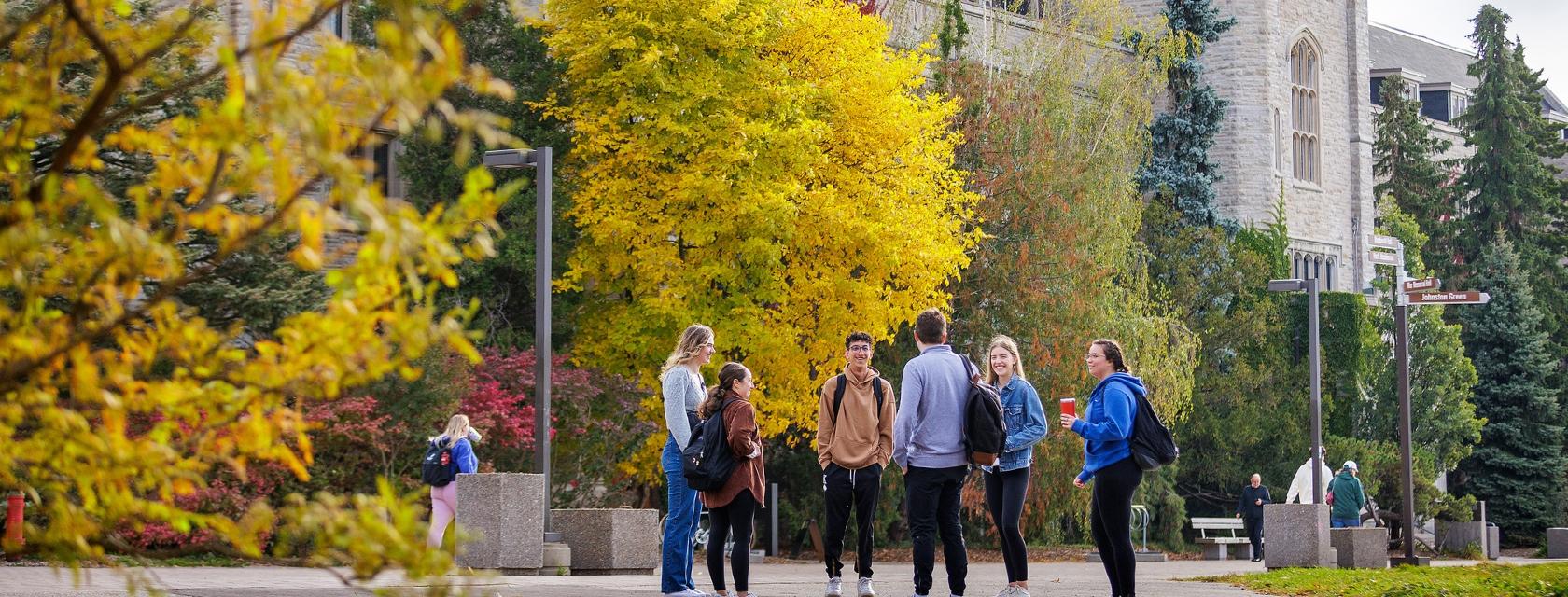 6 students in front of Johnston Hall