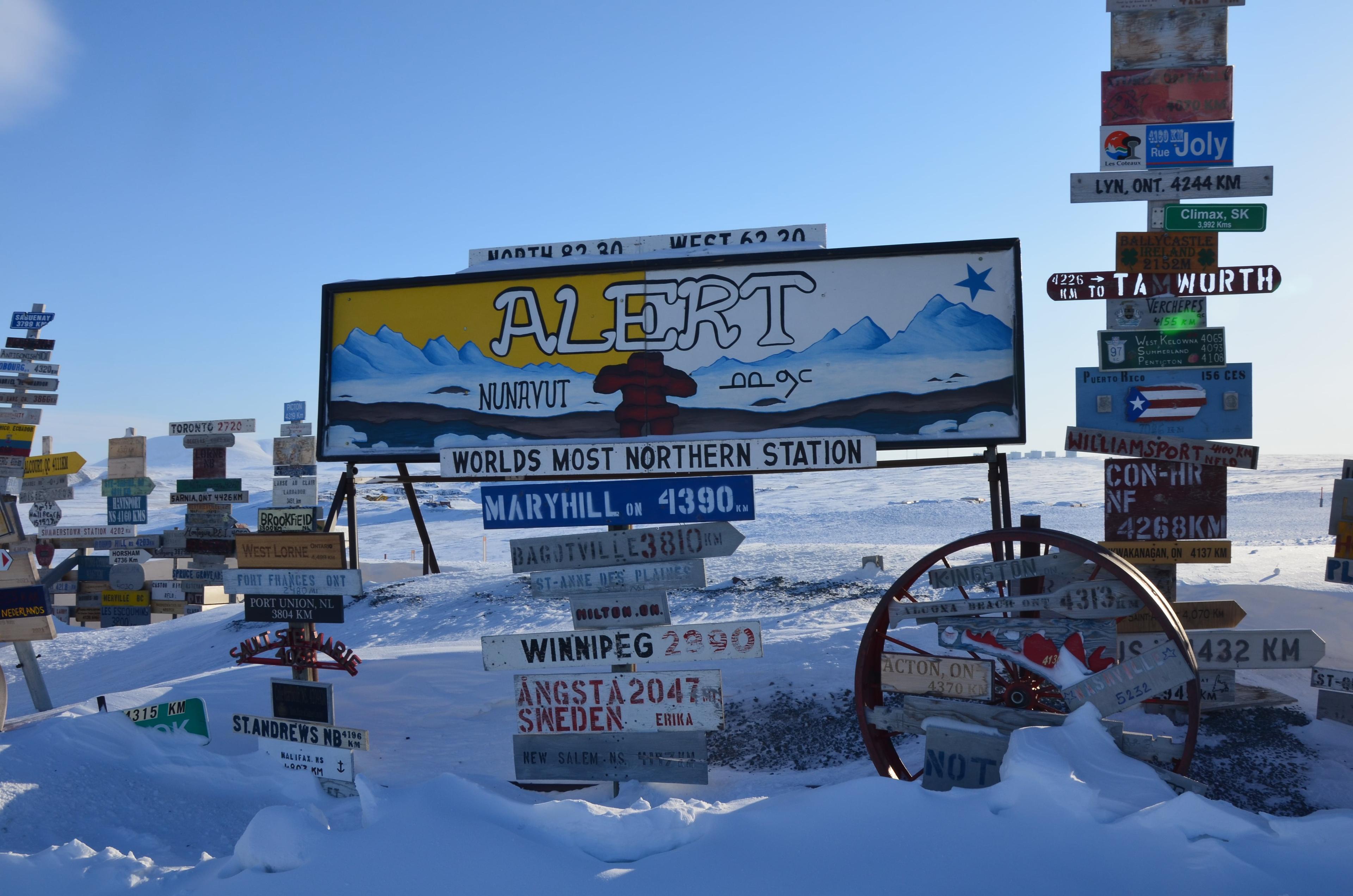 Direction signage for Alert, Canada, with a huge array of other locations.