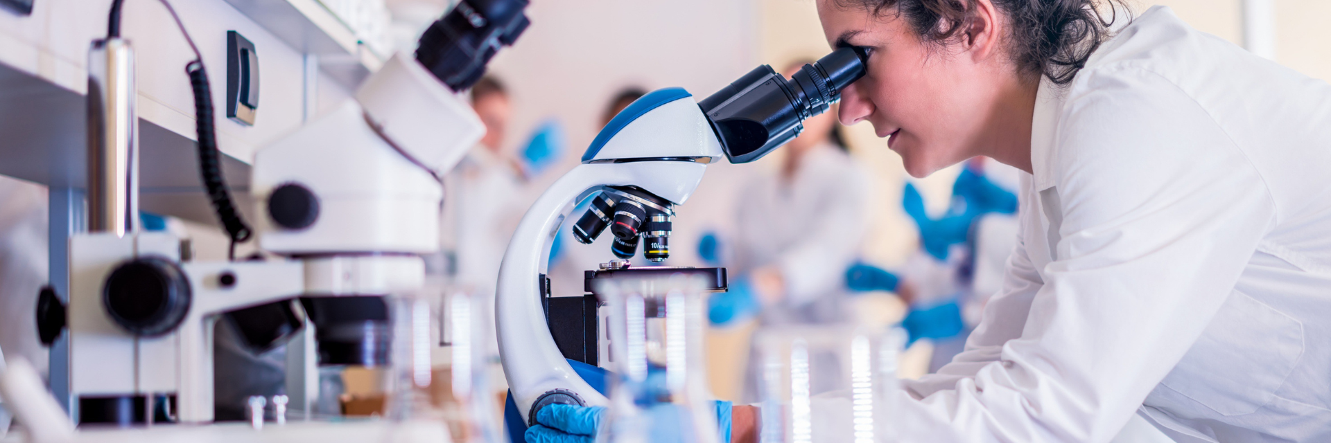 Banner image of researcher in lab
