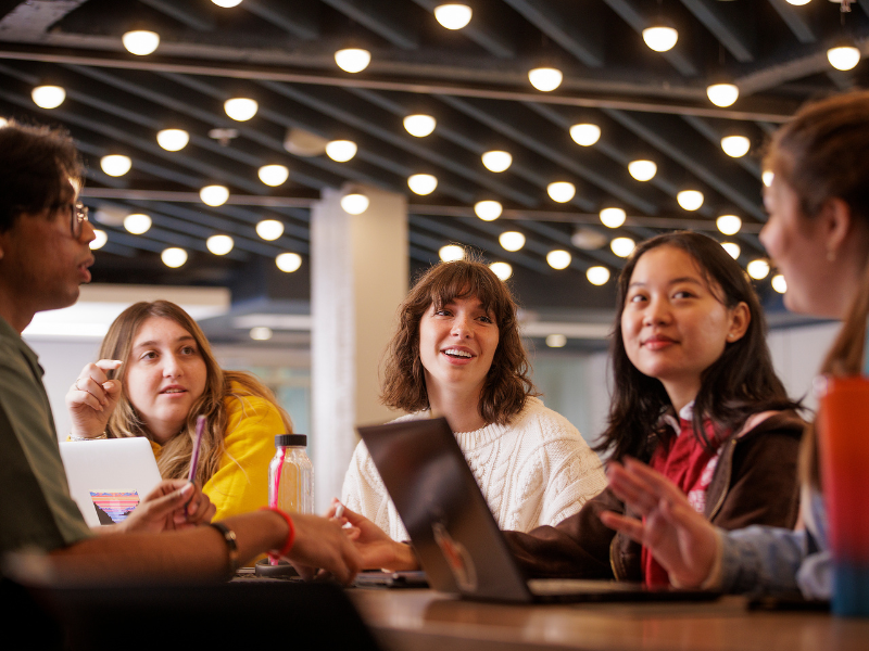 Students talking at a table
