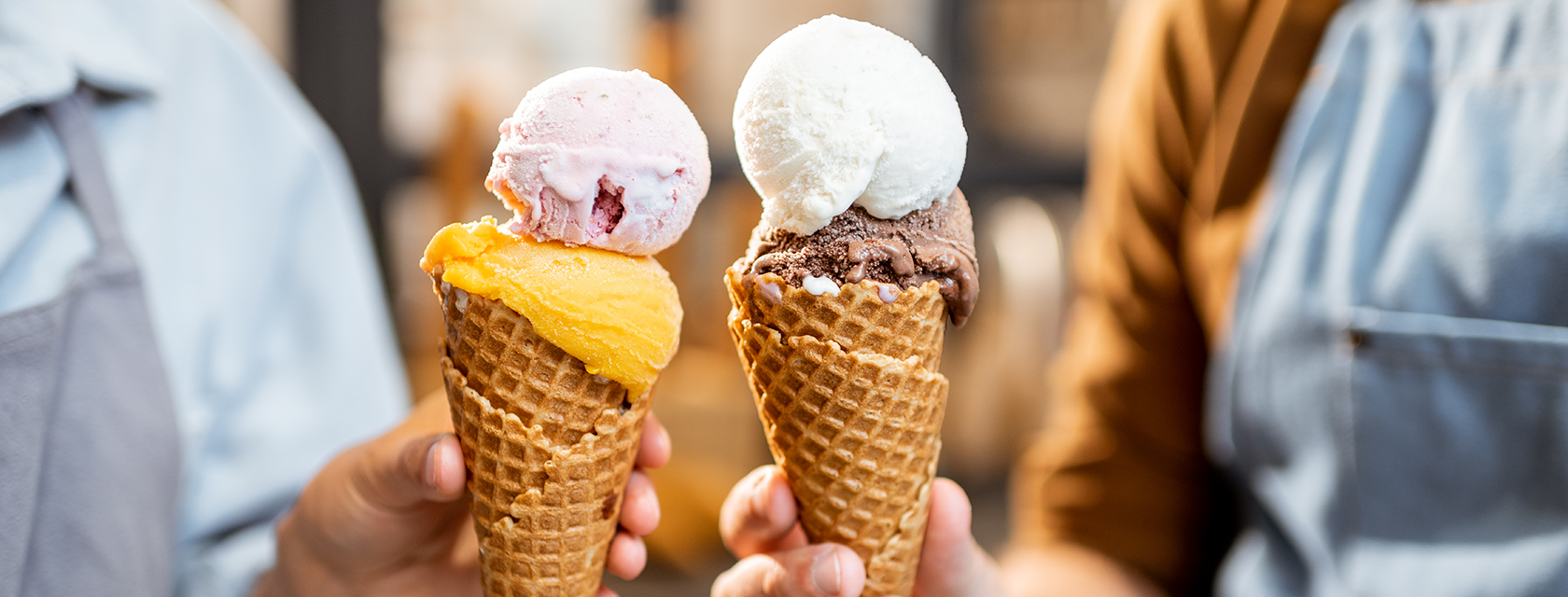ice cream being held by two people