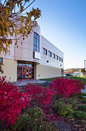 the gfic building with flowers surrounding the building