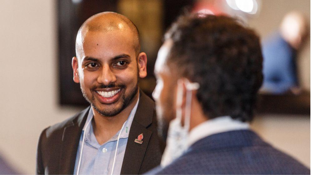 Man smiling during a conversation