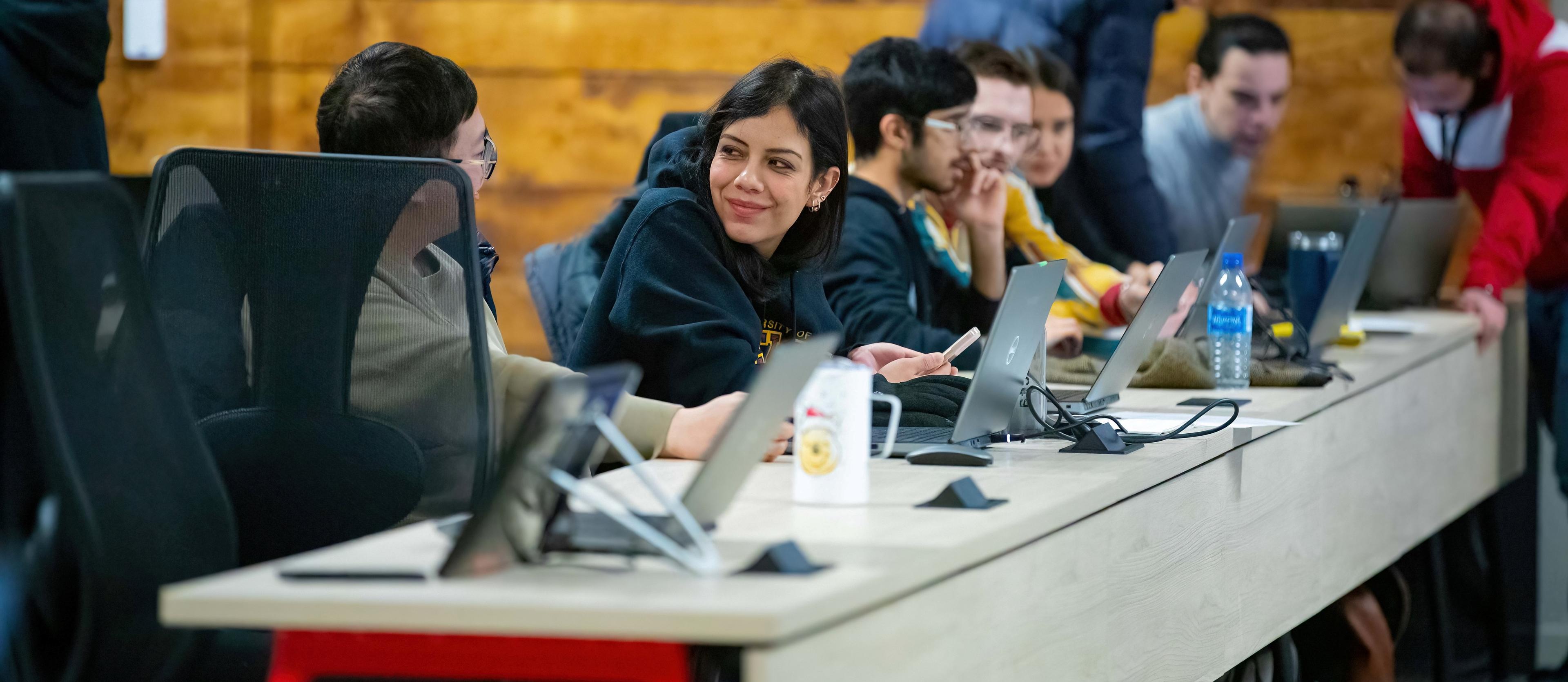 Students sitting at a table during lecture