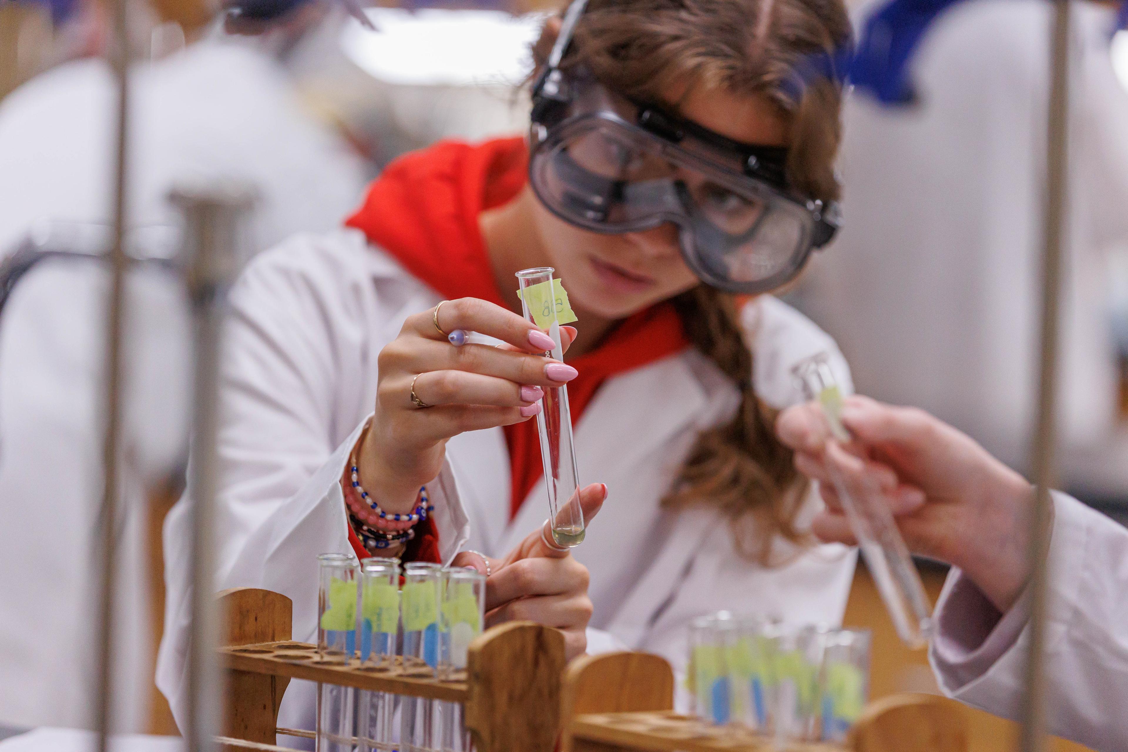 Student performing a chemistry experiment