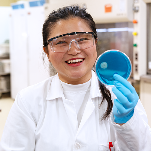 Student holding petri dish