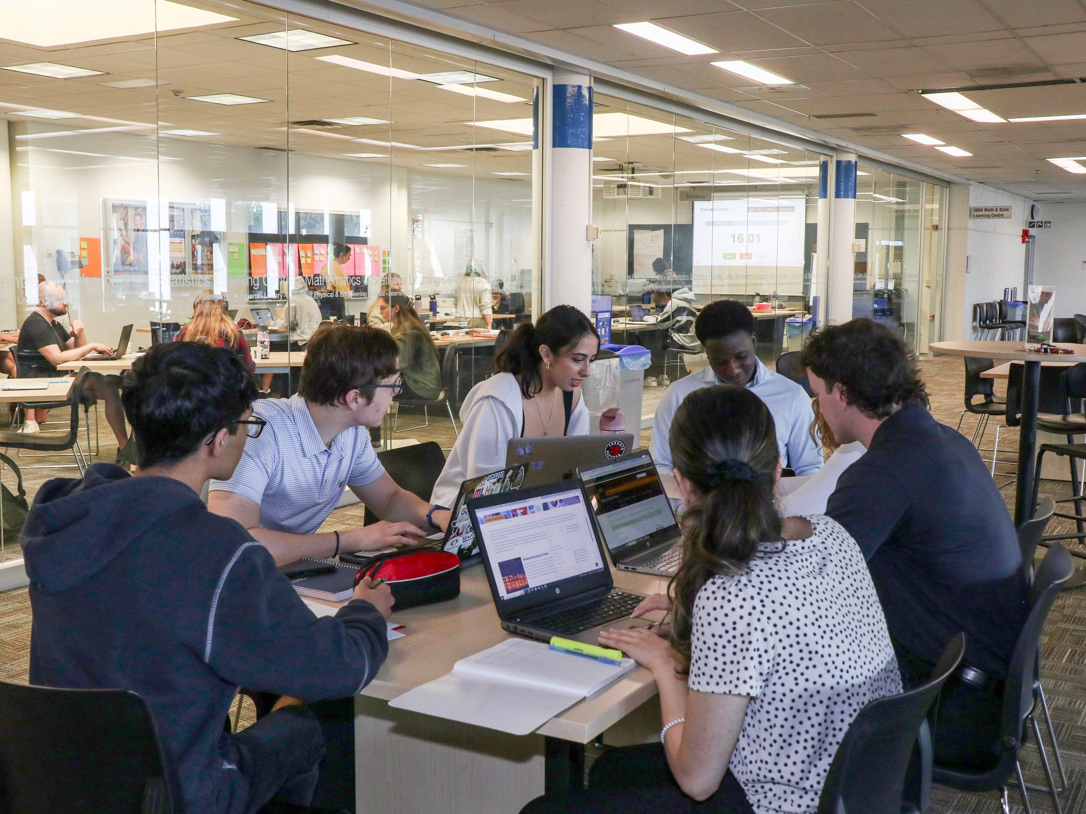 A group of students studying in the Math & Stats Learning Centre.