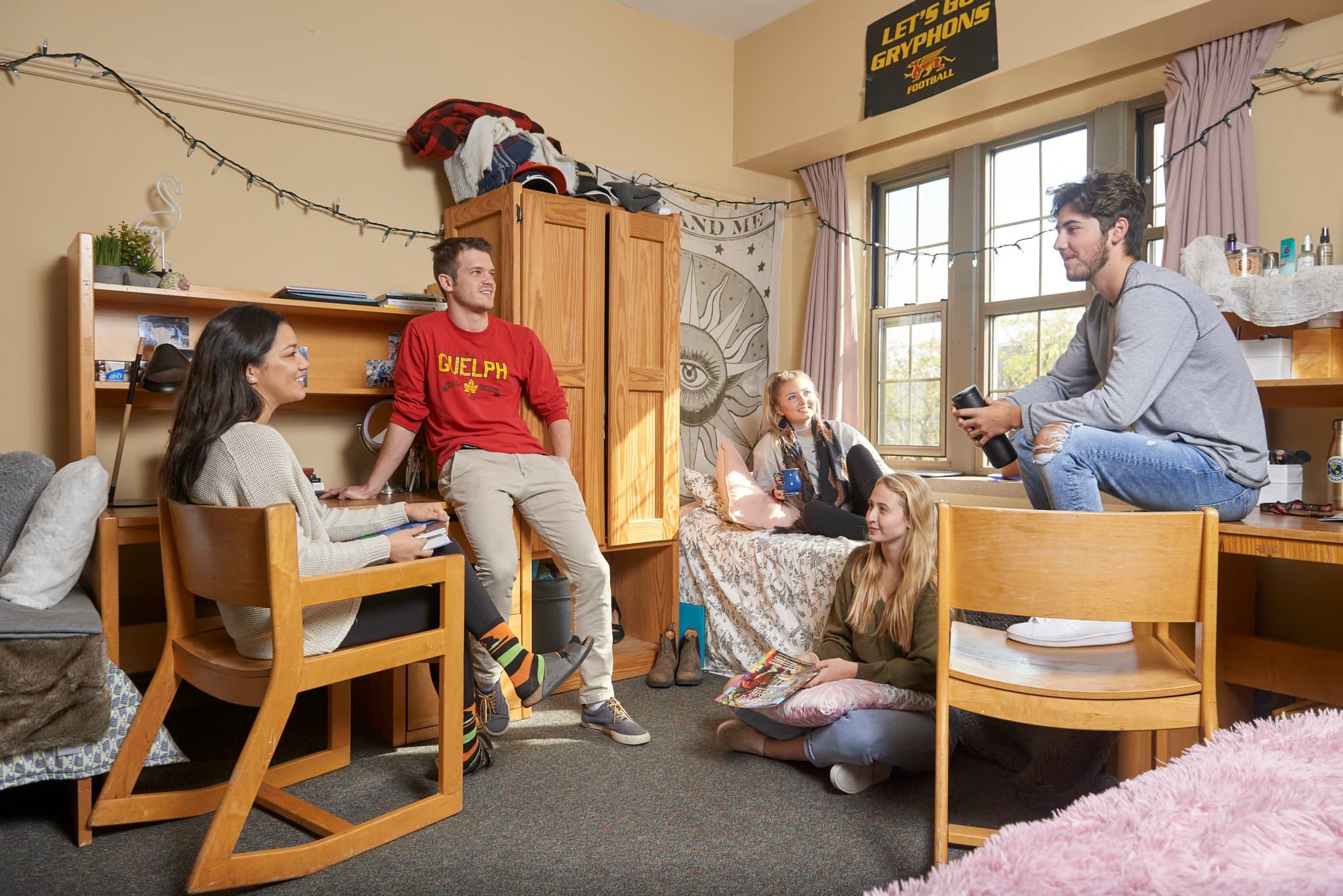 Students talking in a dorm room