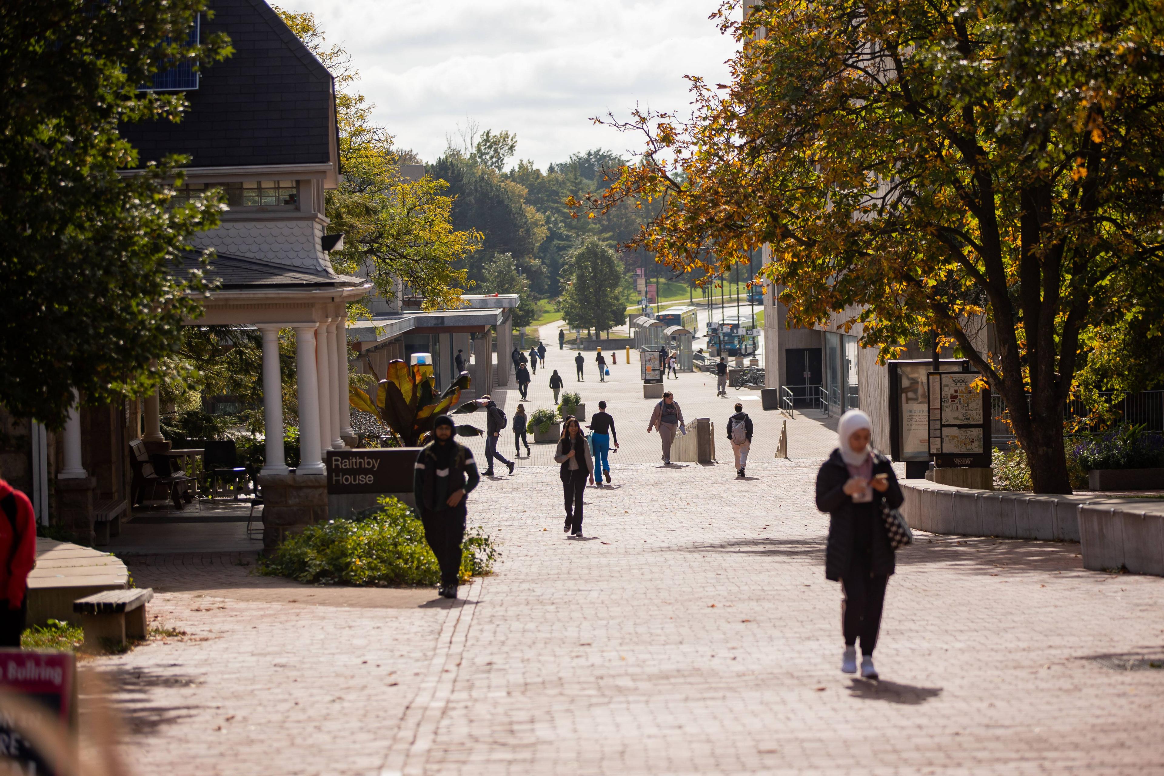 Students walking on campus in the summer