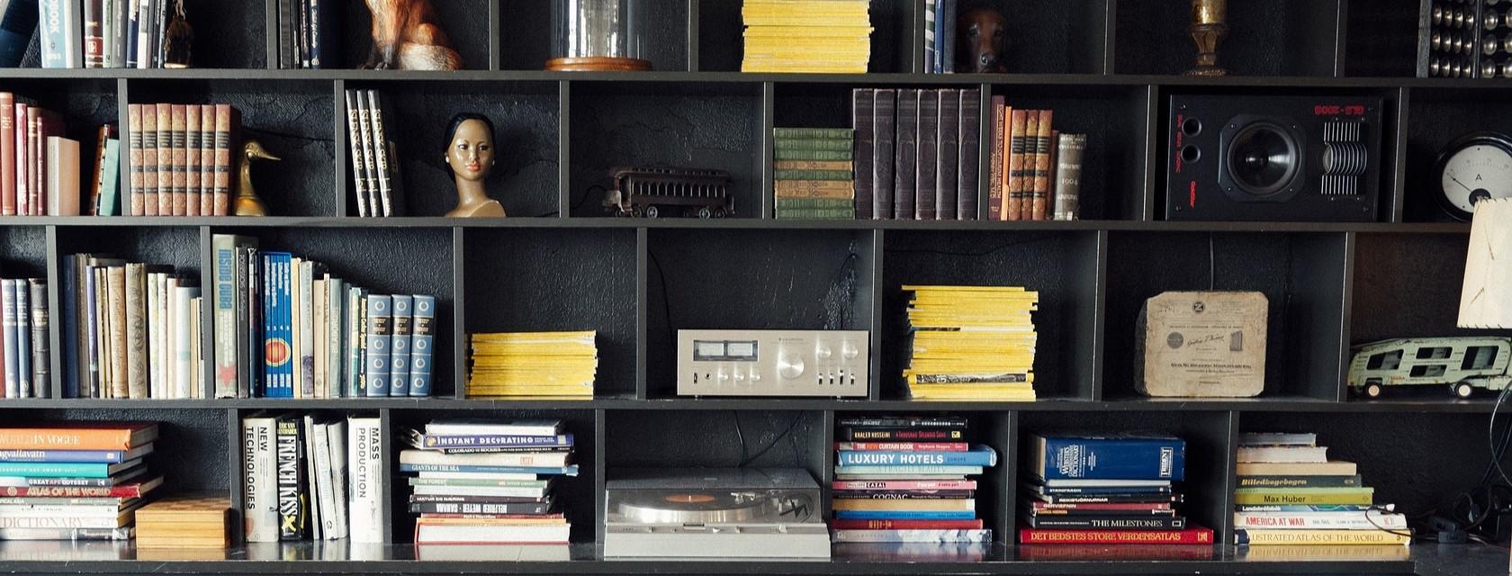 Bookshelves filled with books of various colours