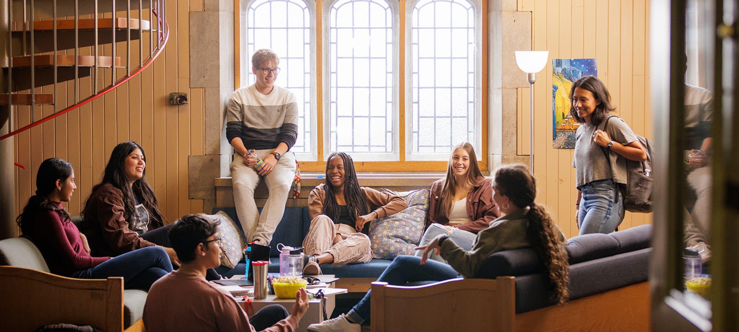 Students sitting and talking in Johnston Hall Lounge in Residence