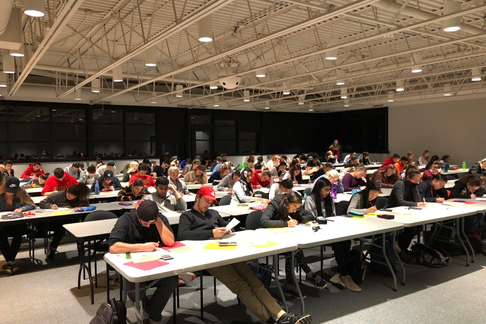 Students writing mock midterm in residence