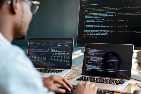 A student typing a code/script on a computer
