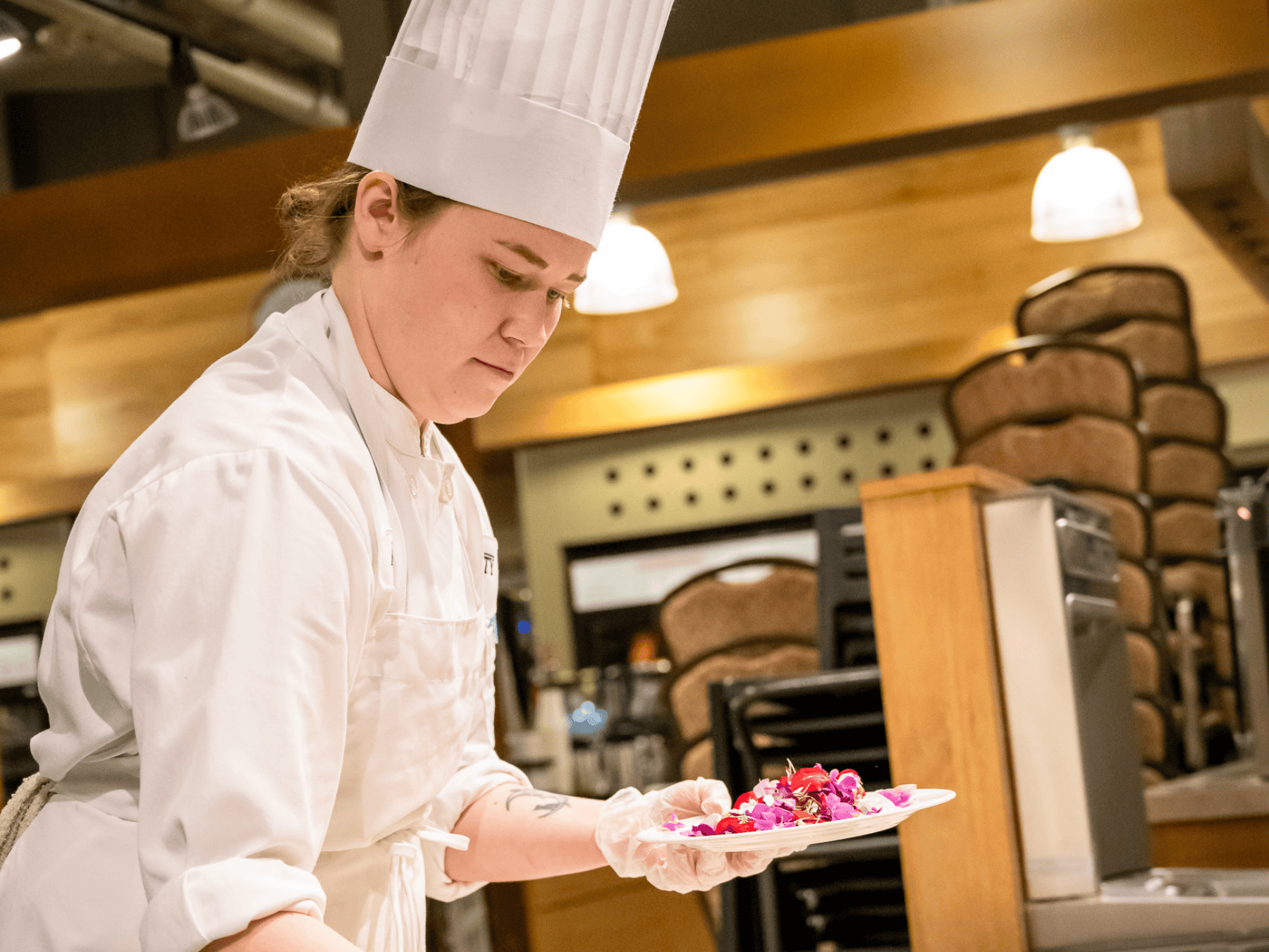 HS chef plating with flowers