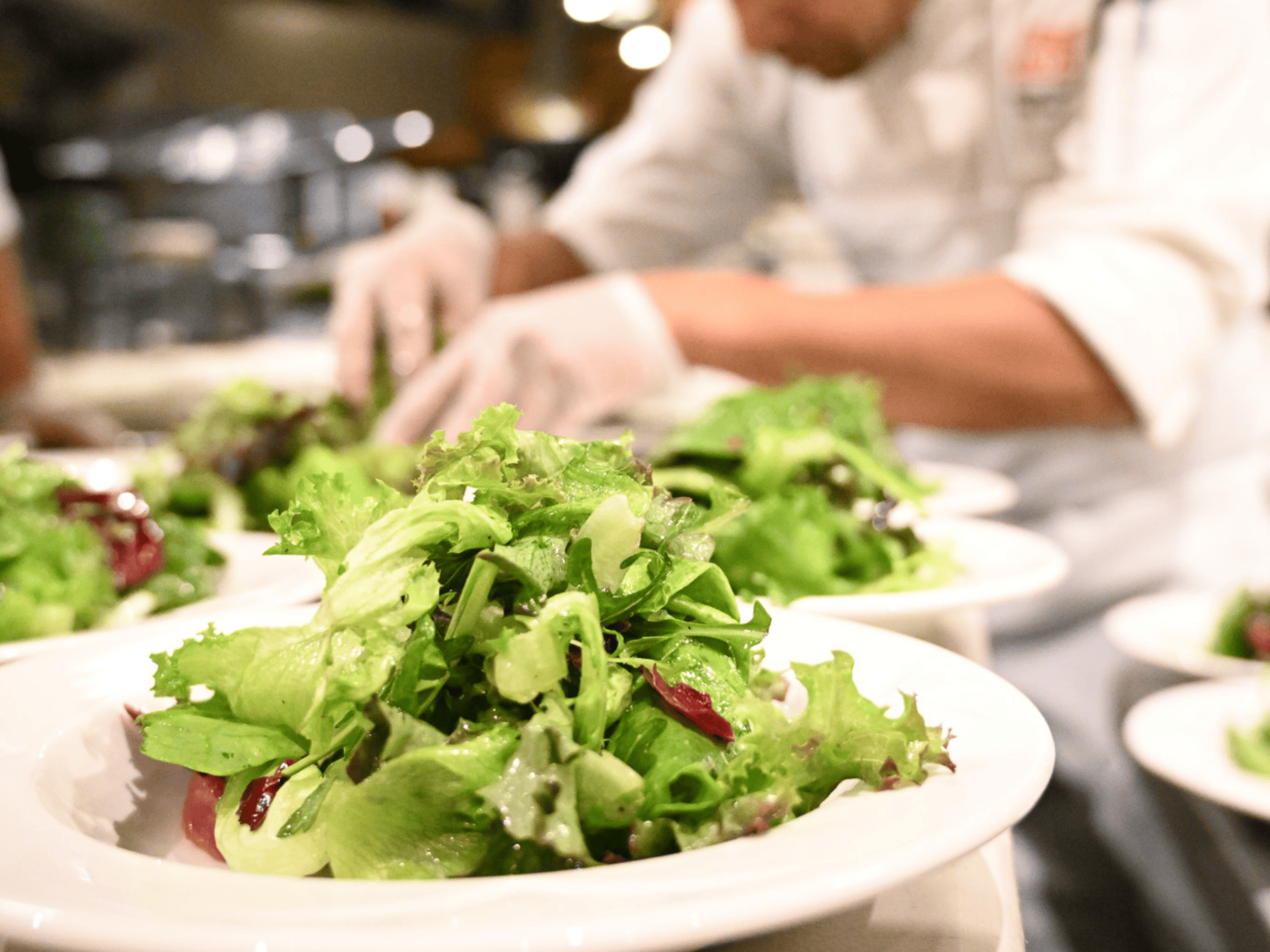 Salads being plated