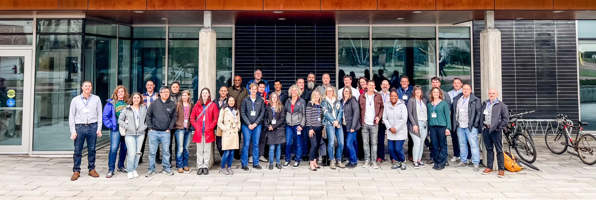 a large group of alumni standing outside of Thornbrough