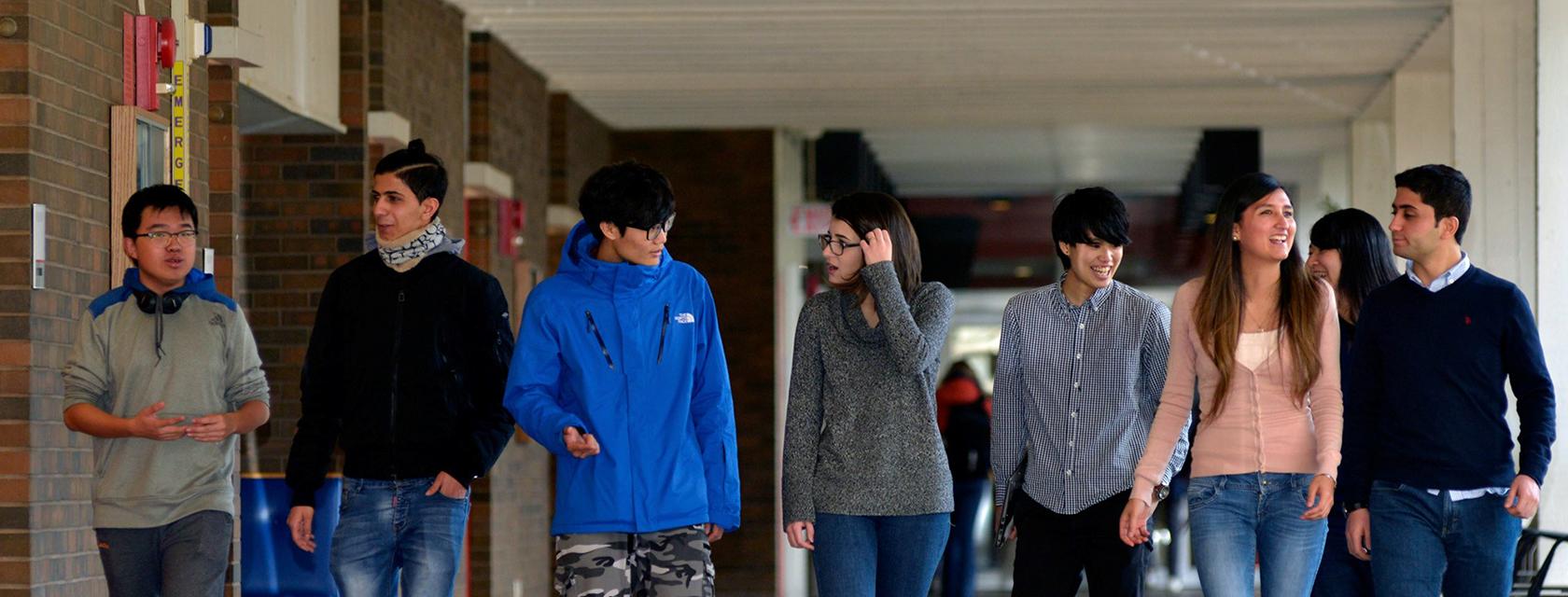 Group of English Language Programs students walking down a hallway.