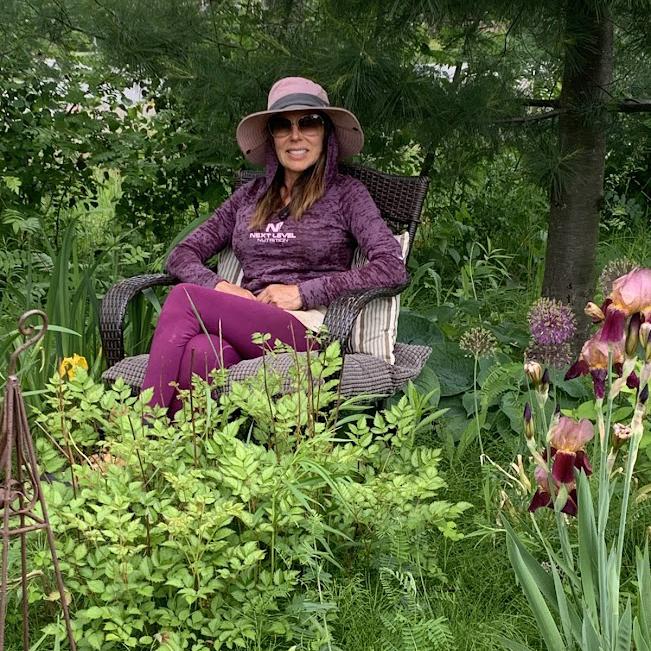 Woman sitting in her garden.