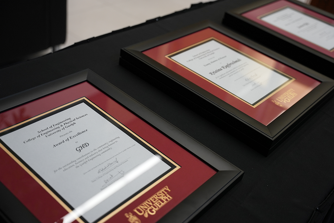 Award certificates in frames on a table