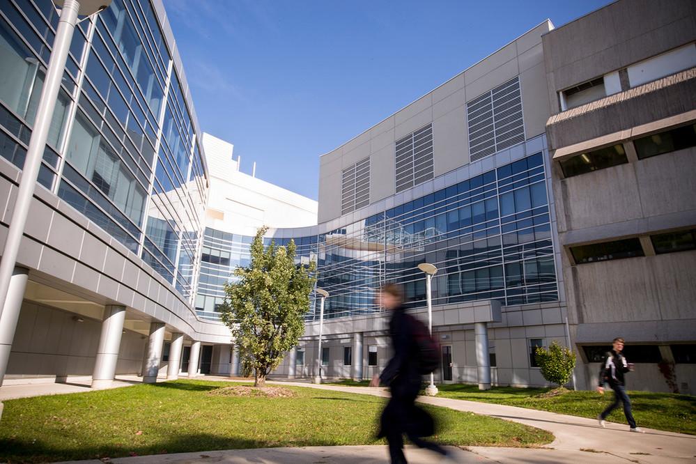 Summerlee Science Complex with student walking past.