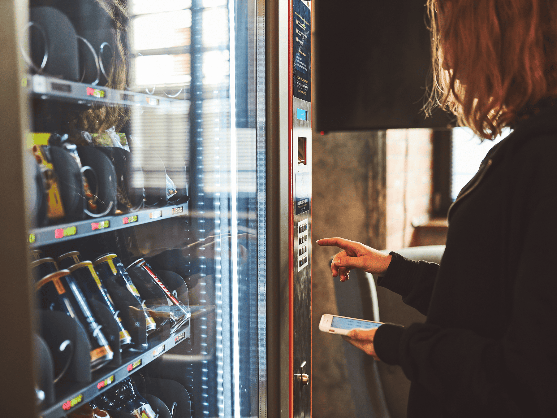 student using vending machine
