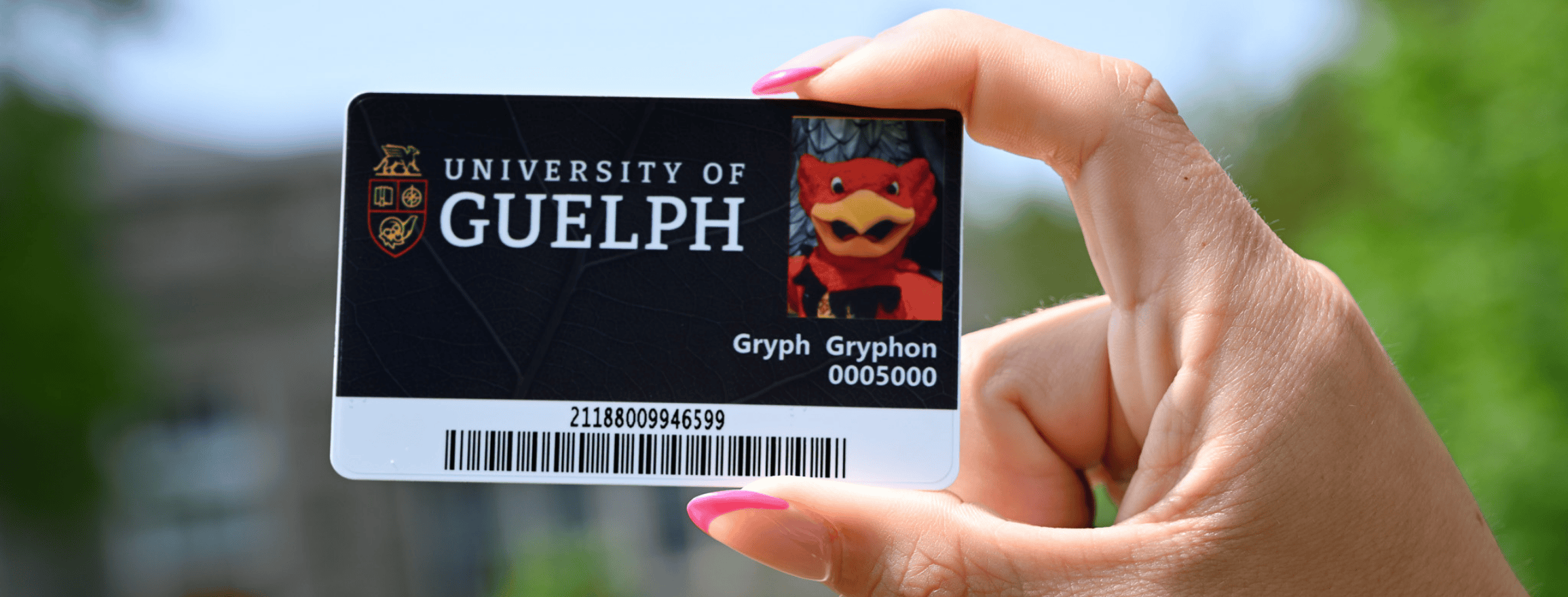 hand holding a campus card outside
