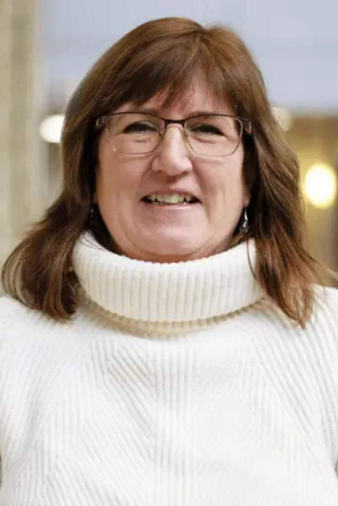 Bonnie Lasby smiling.