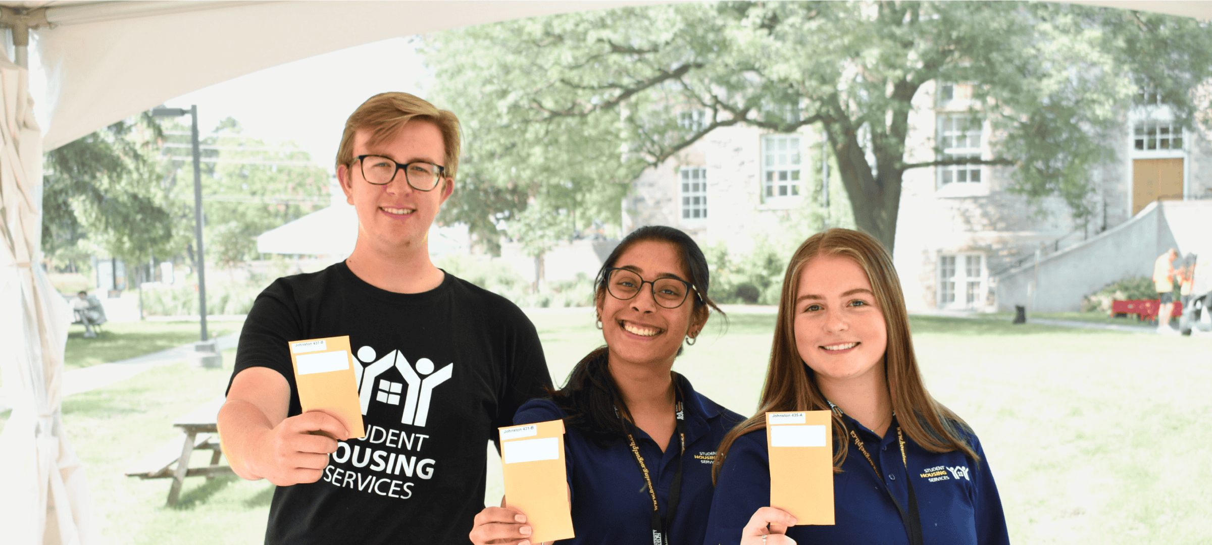 Group of Facilities Desk Workers holding residence keys