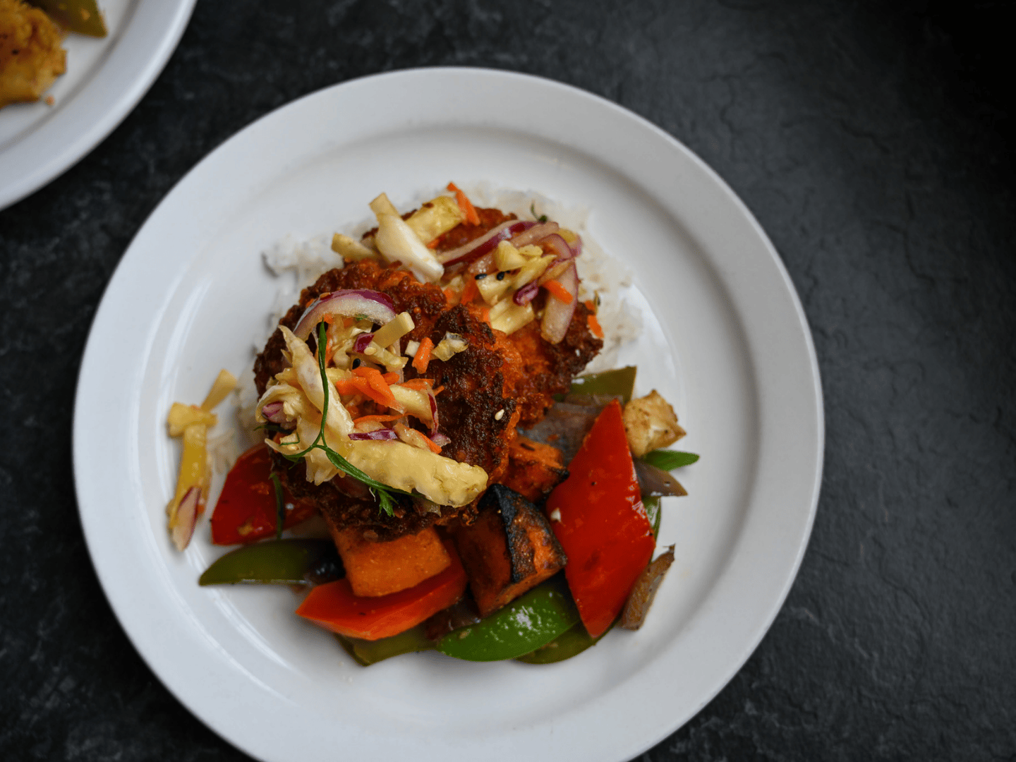 a plant based meal featuring colouring slaw and veg