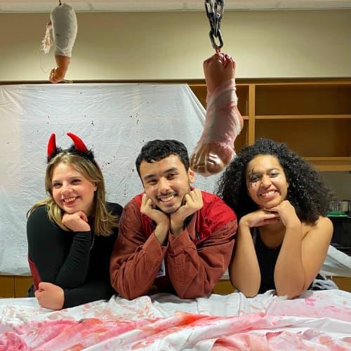 Three students dressed up in the halloween costume