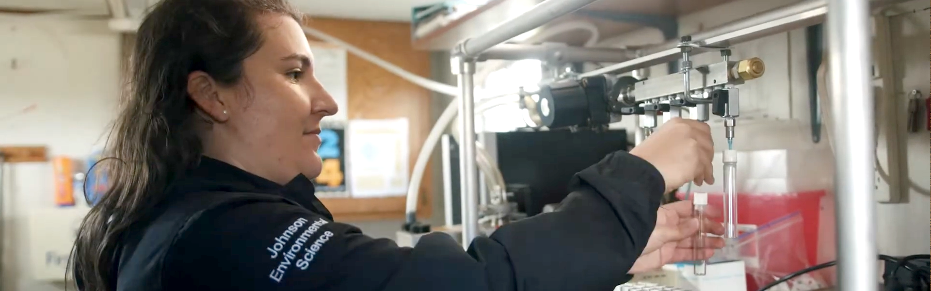 a student inspecting a specimen in a lab
