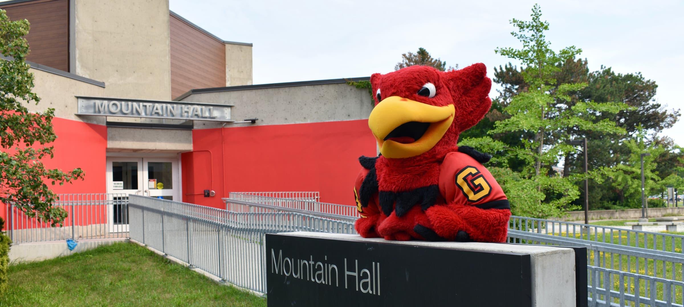 Gryphon standing outside the Mountain Hall Residence