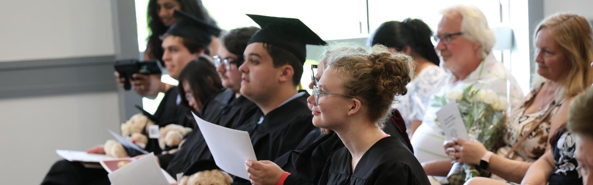 Graduating students seated at their convocation ceremony.