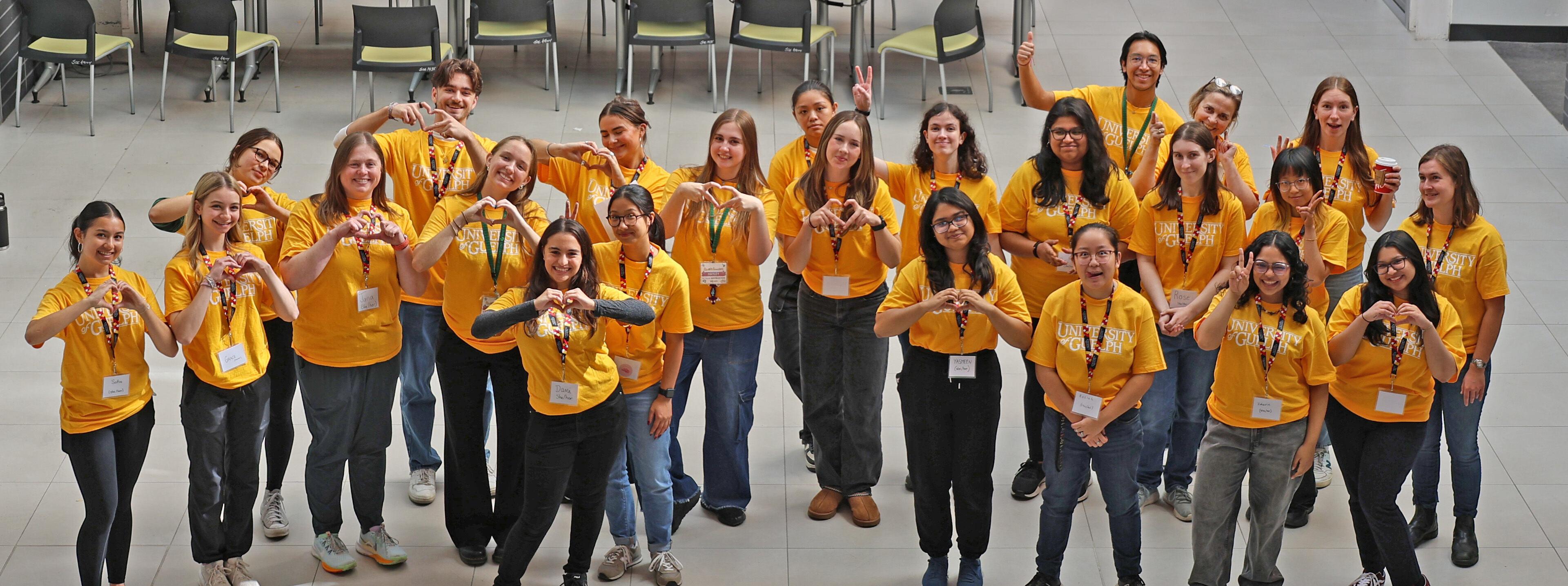 Group of volunteers standing together and smiling.