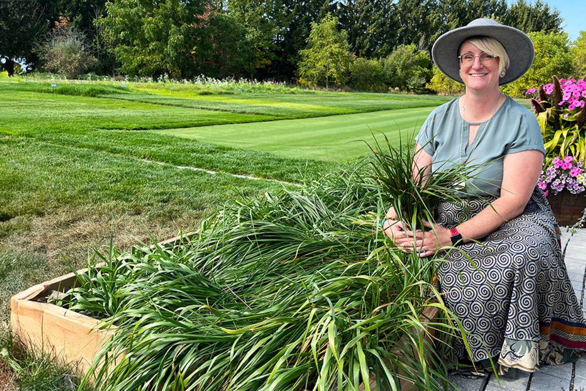 Dr. Sara Stricker with the sweetgrass garden she created at the Guelph Turfgrass Institute.