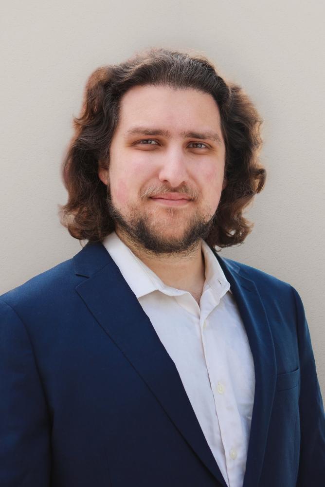 Farhad Omarzad smiling.