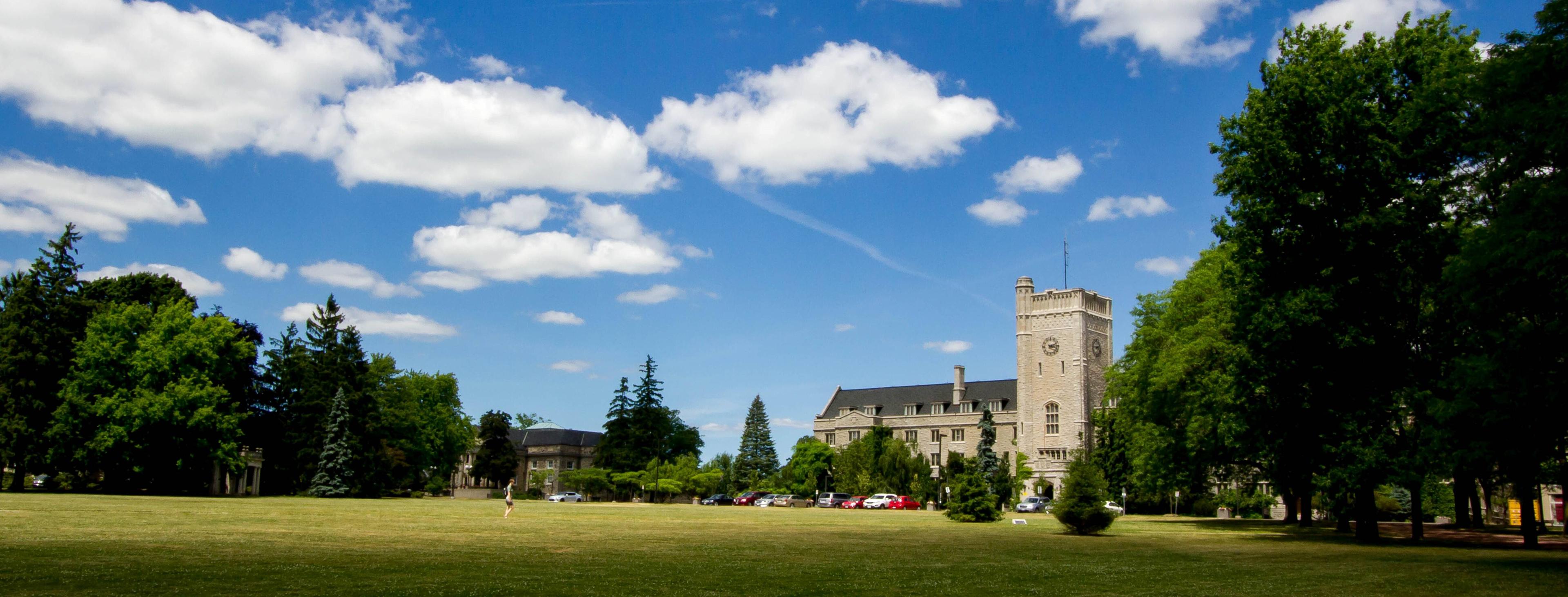 Bright and clear day of Johnston green and Johnston hall in the distance
