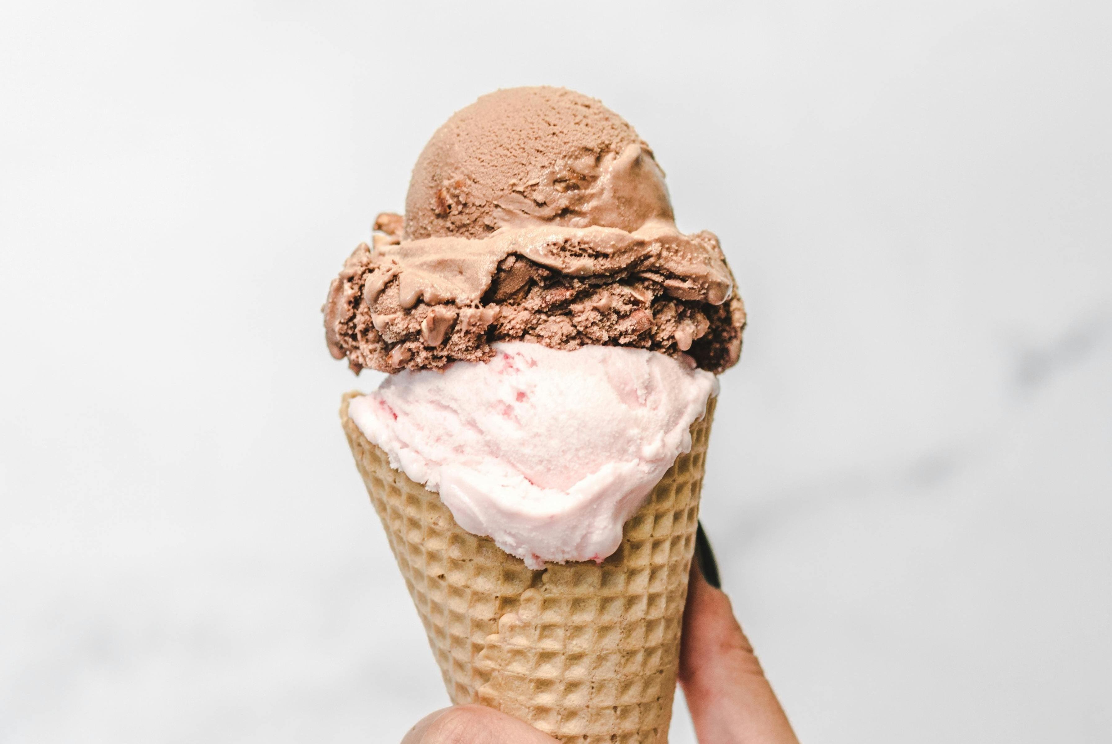 Scoop of chocolate and strawberry ice cream.