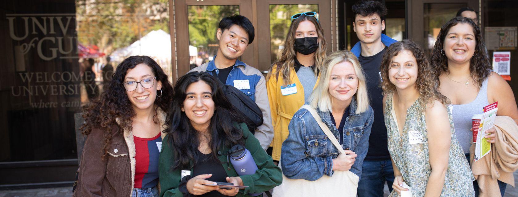 A group of grad students gathered together