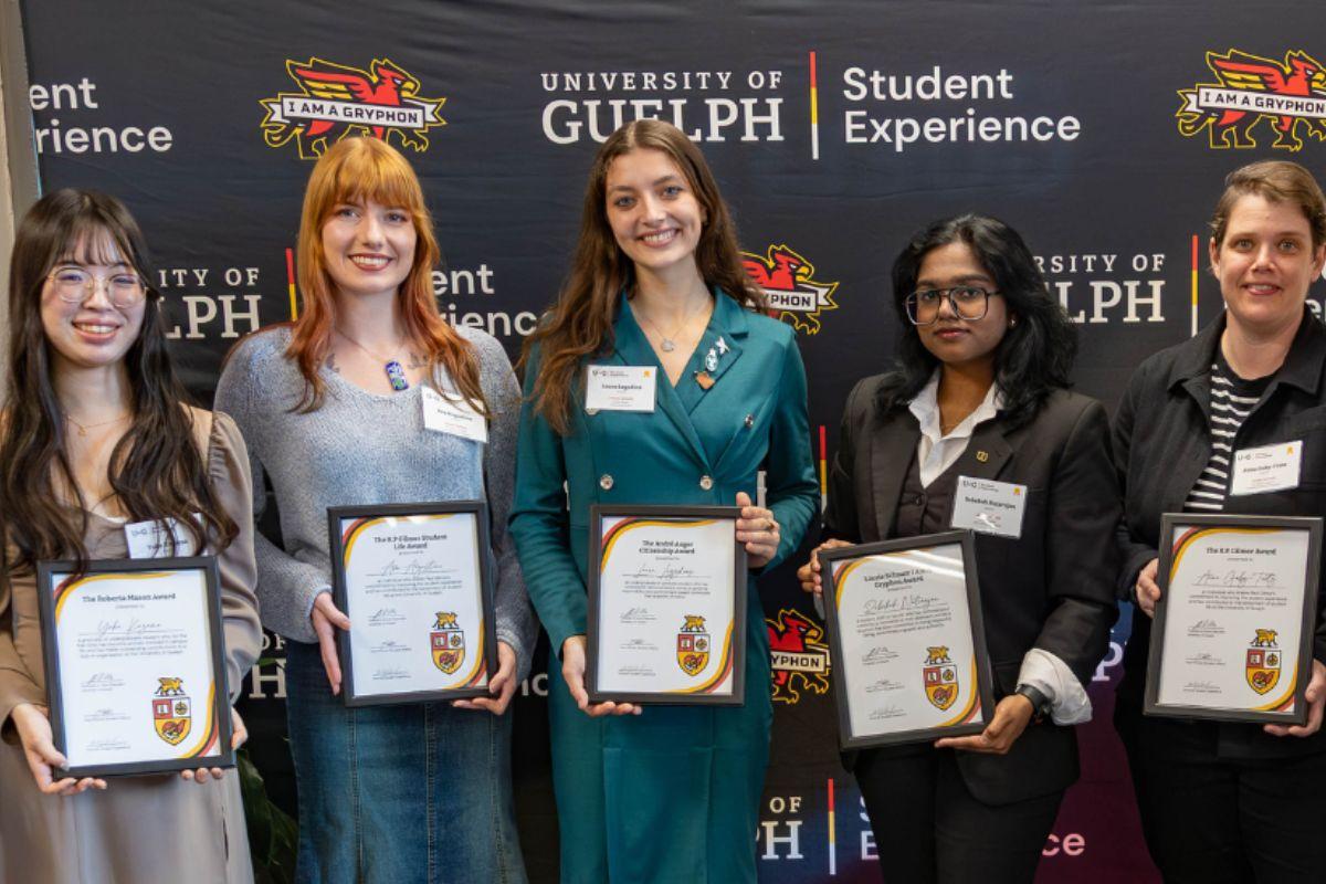 Student Experience Award Recipients holding their awards