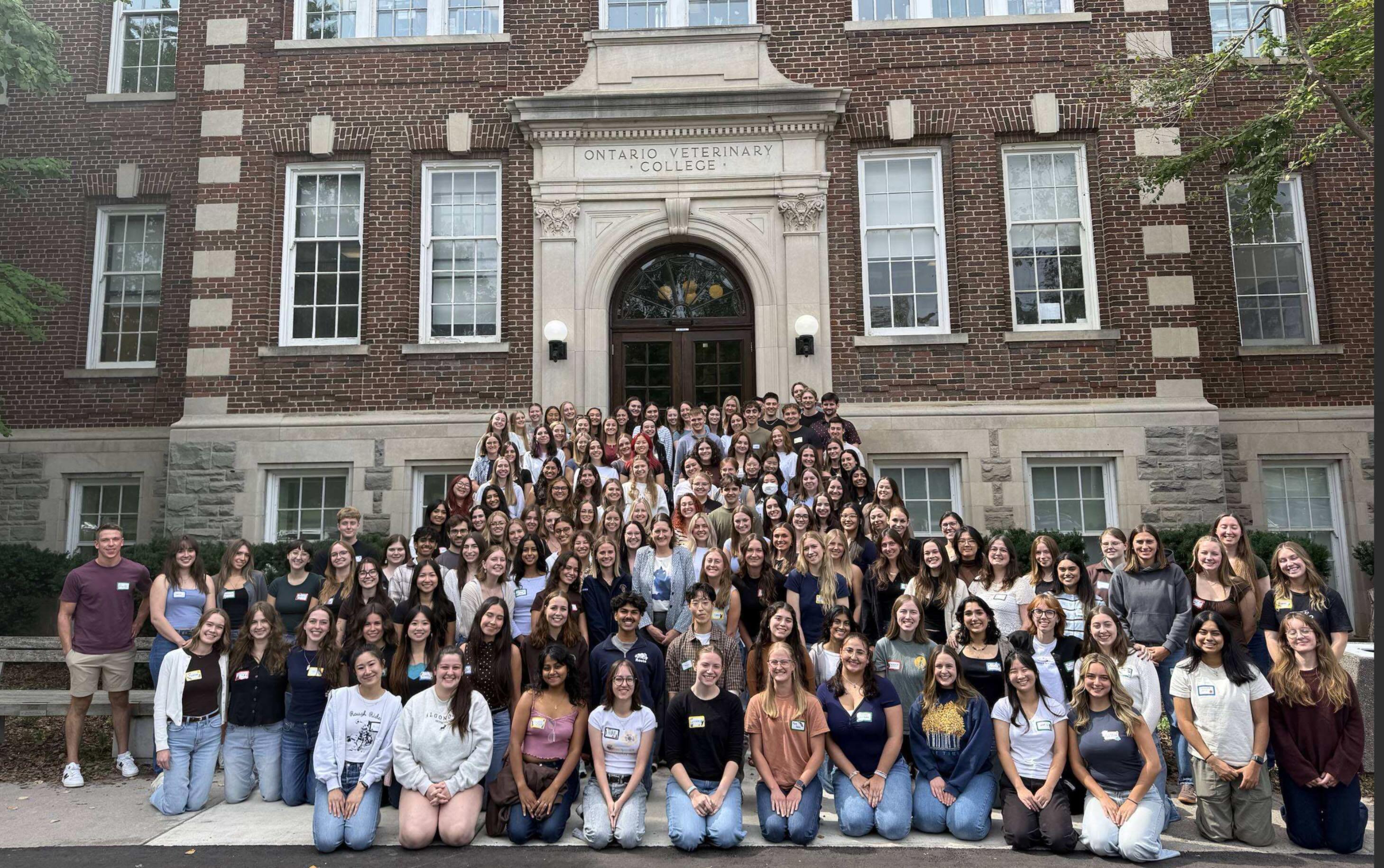 DVM Class of 2030 posed on the front steps of OVC